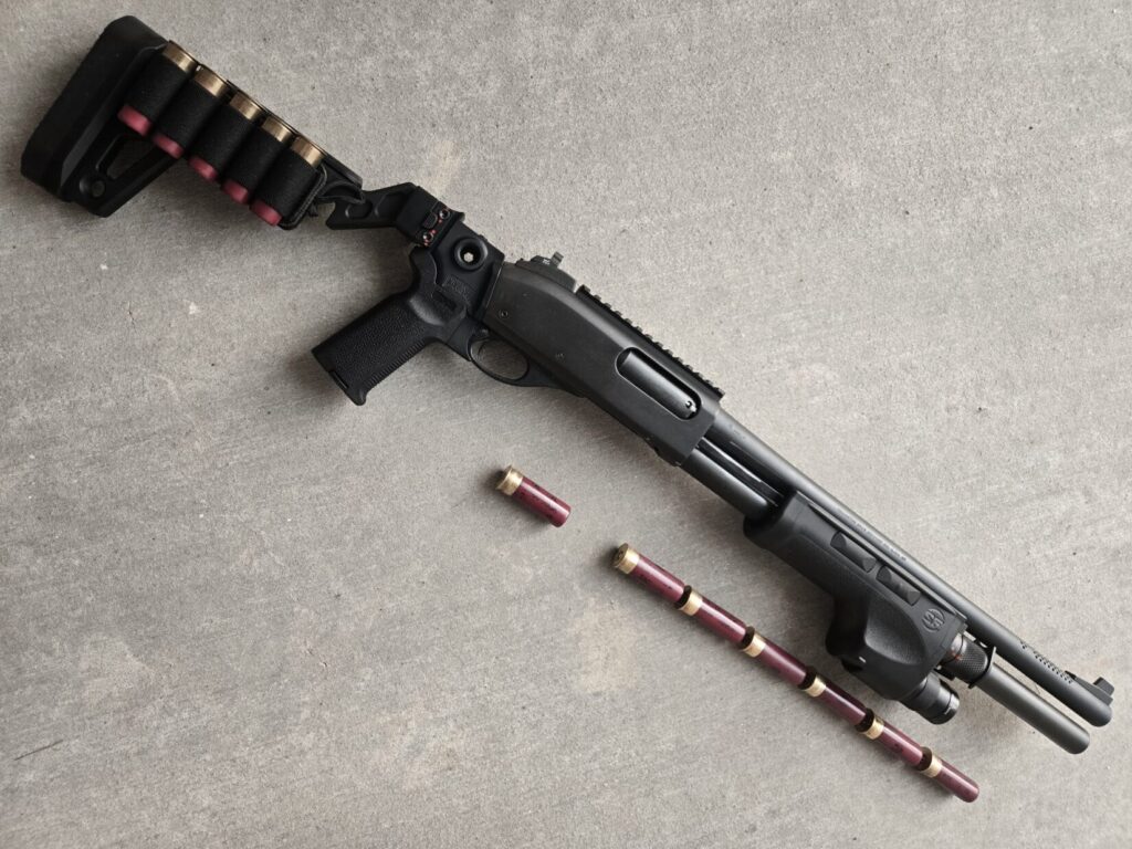A Remington 870 Police magnum with Surefire Forend and Chisel Machining Stock with capacity shown.