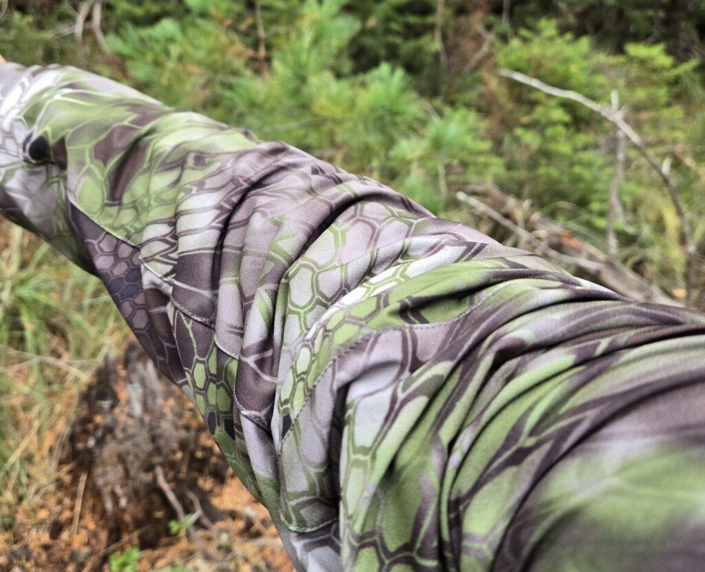 Kryptek Altitude camouflage against natural backdrop