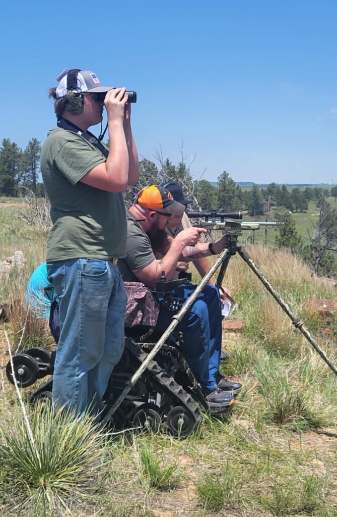 Brad Williams shooting single shot division at HHC with his sons helping.