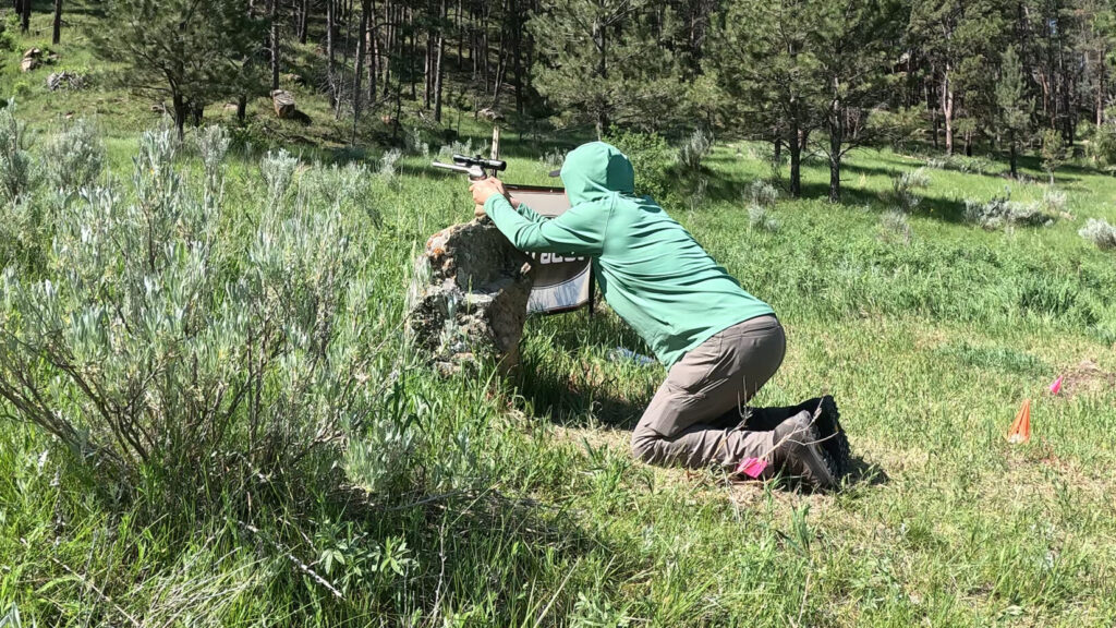 Mladen shooting off a rock in revolver optics division at 2025 Handgun Hunters Competition