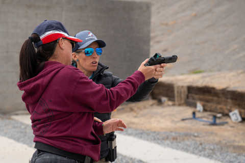 Lanny Barnes, aka Lanny Oakley, instructing a first-timer in competitive shooting