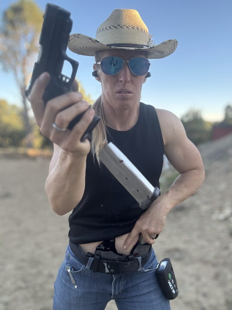 Lanny Barnes doing a speed reload, accessing new mag from incog x mag caddy, demonstrating how concealed carry for women works with this AIWB holster