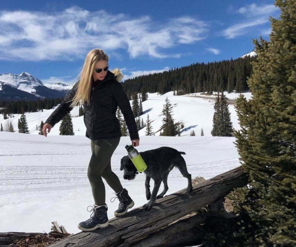 Lanny Barnes exploring snowy mountains with range dog, concealed carry for women