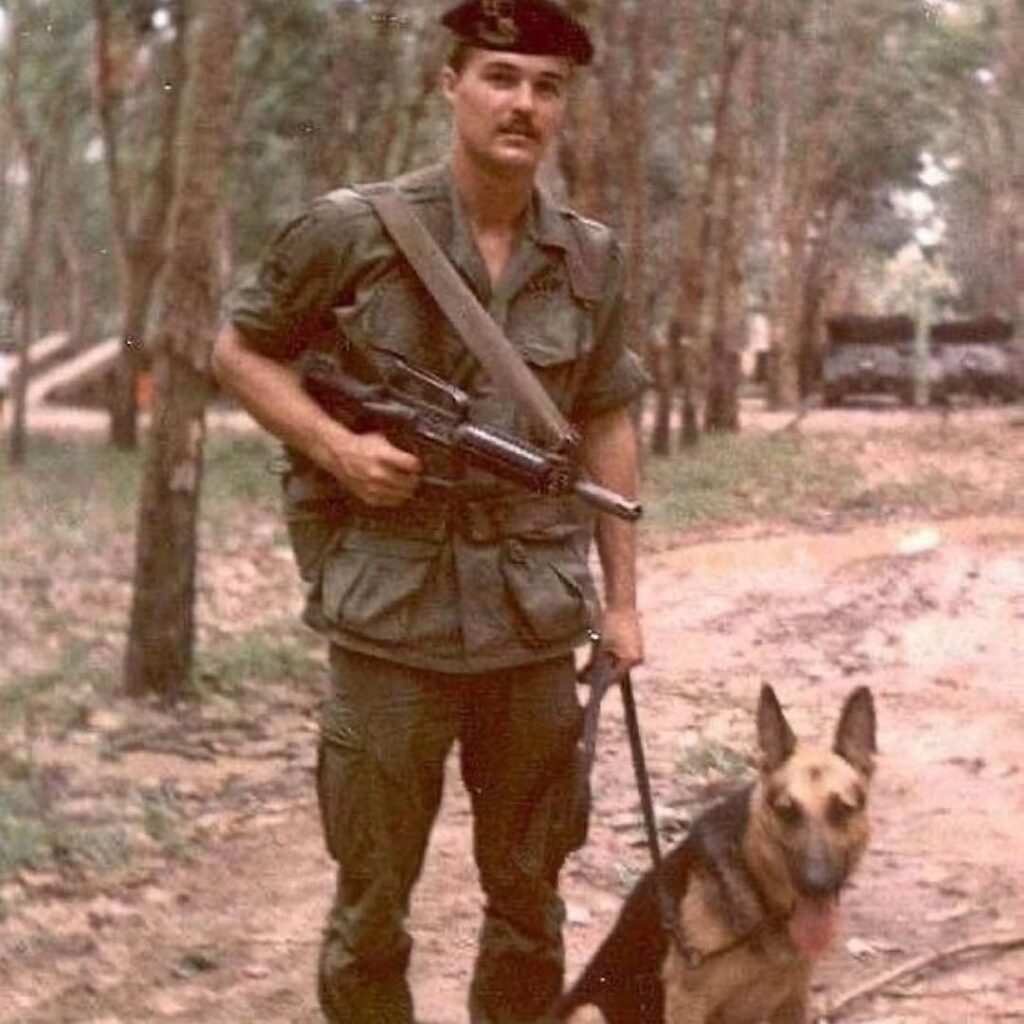 Congressional Medal of Honor recipient SSG Hartsock with his war dog somewhere in Vietnam