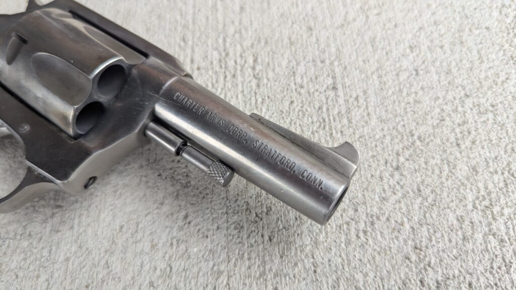 Stainless revolver on concrete markings
