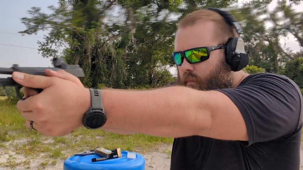 Man shooting Masada Slim Elite - photo showing flat Recoil impulse