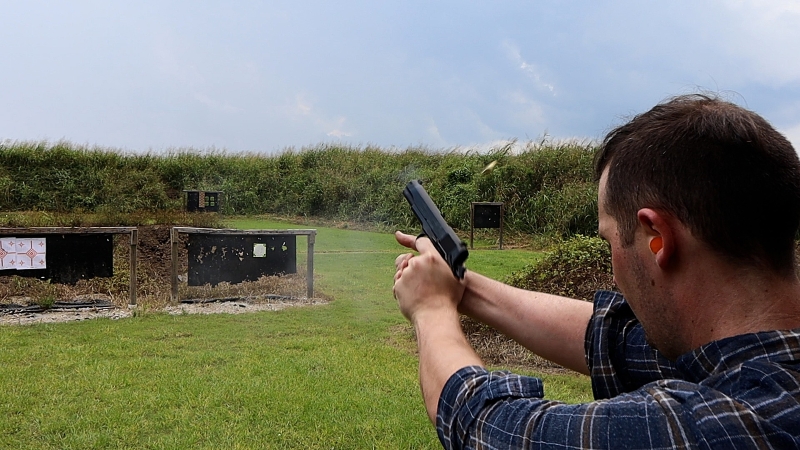 45 acp recoil from a 1911 pistol on a shooting range