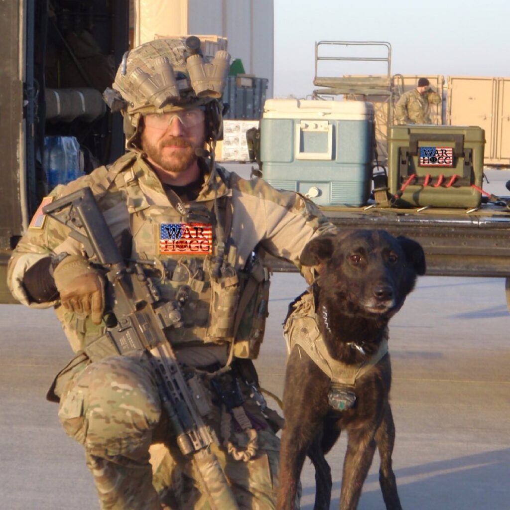 Rick HOGG owner of War HOGG Tactical and his combat assault dog Duco after a combat mission in Afghanistan wearing their combat assault gear