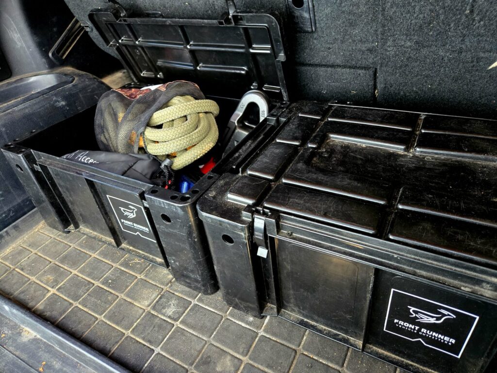 Overlanding gear: Front runner boxes in the back of a 4runner with one open to reveal recovery equipment