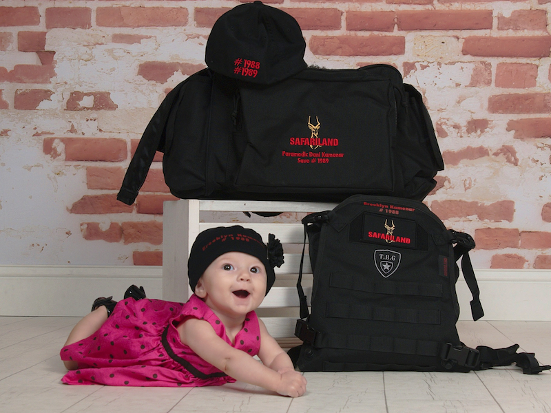 Baby Brooklyn Kamenar is posed with her mother's vest after the SAVES