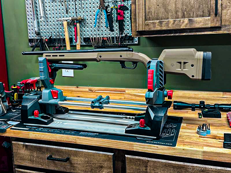 workbench with real avid master gun workstation and Savage rifle ready for scope to be mounted