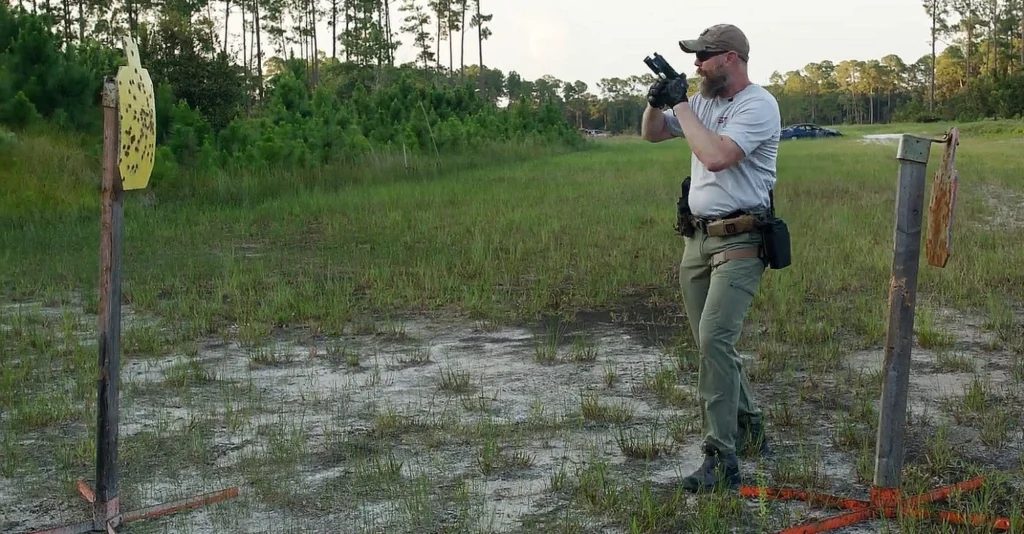 rich graham demonstrating muzzle discipline drill with handgun at high ready