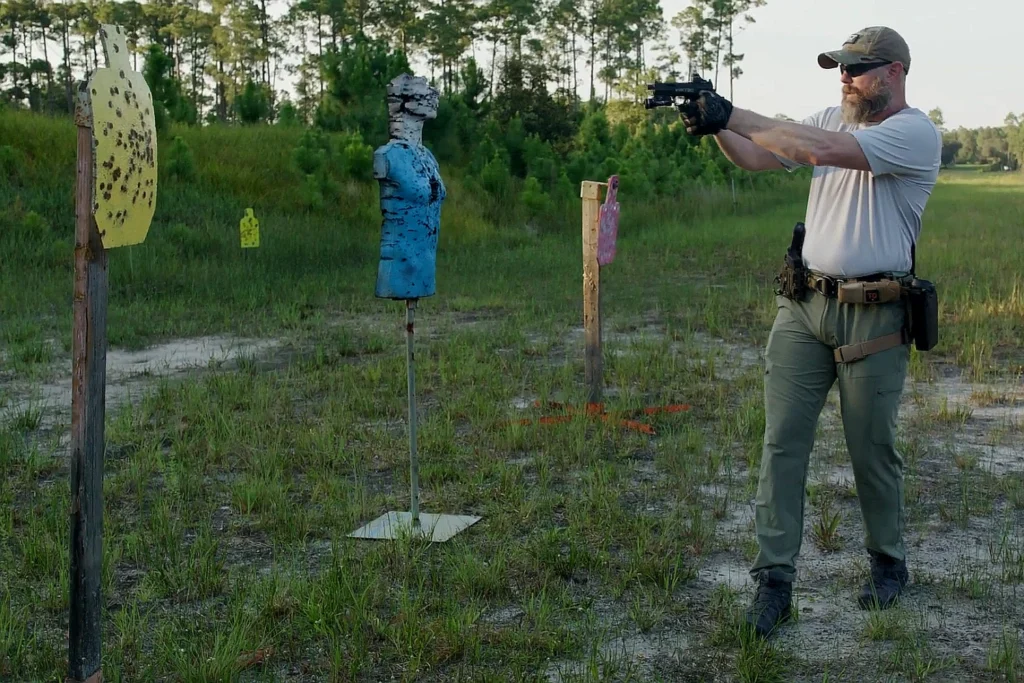 Man firing Pistol on a Range