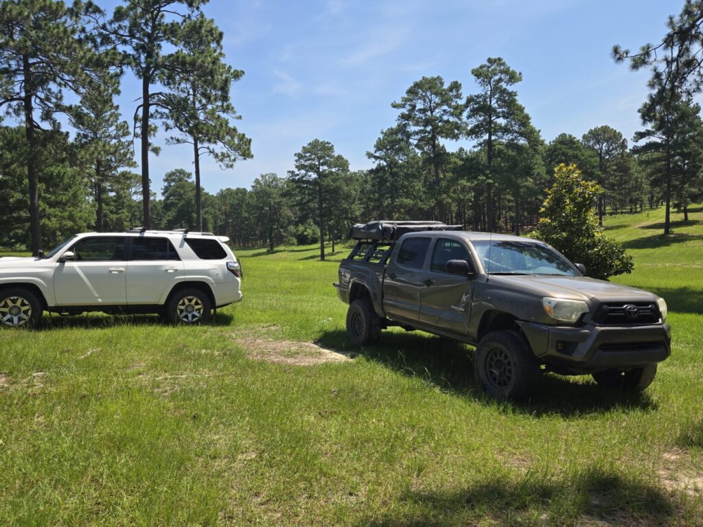 Toyota 4Runner and Tacoma facing outward as part of a wagon-wheel security formation.
