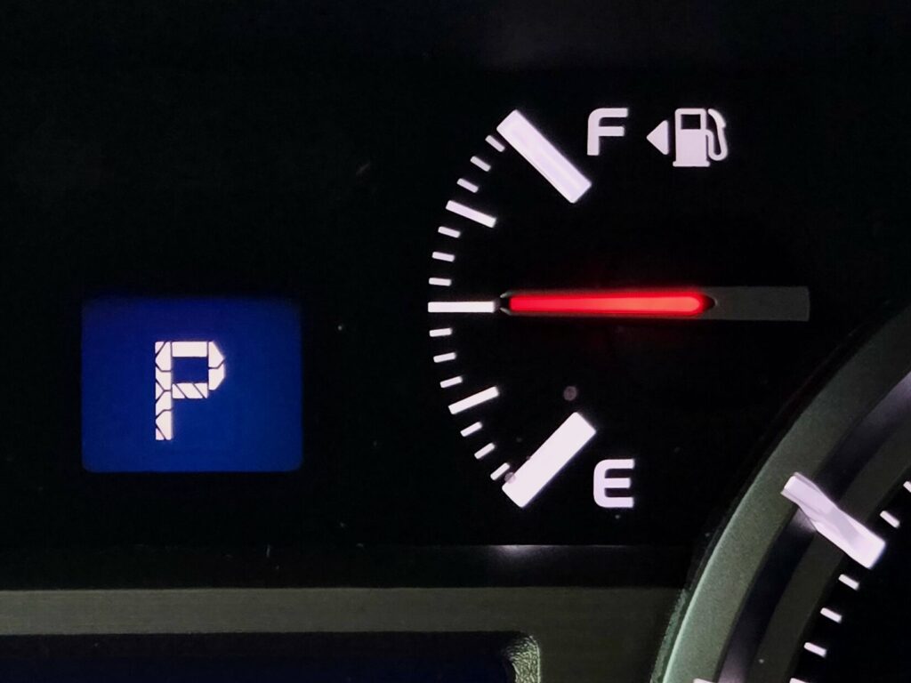 The half-tank habit is refilling when the vehicle reaches half tank instead of when the low fuel indicator goes off.