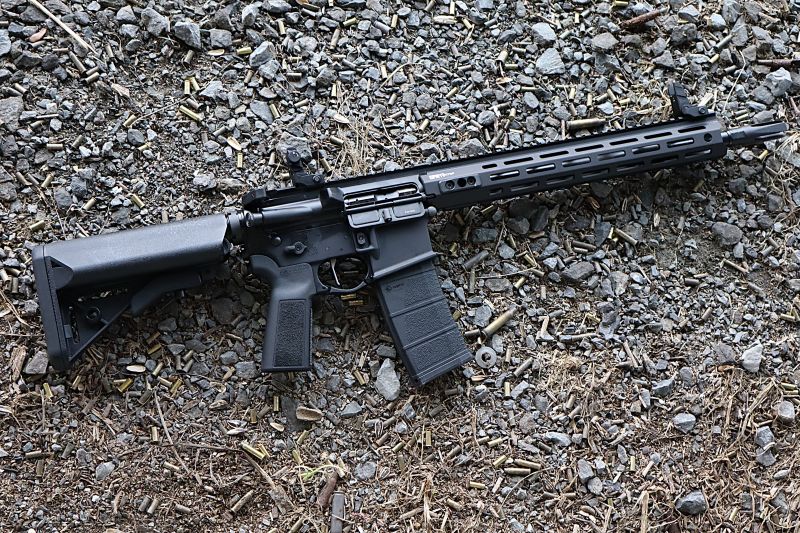 springfield armory saint victor rifle laying on gravel and empty brass