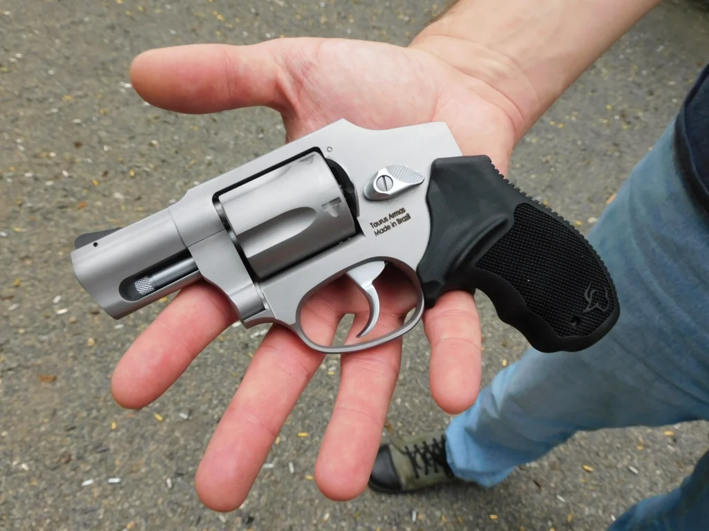 Taurus 850 revolver in hand to show controls