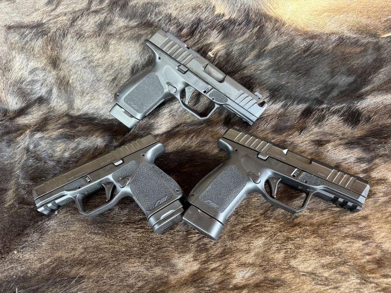 A trio of feature-rich Rost Martin pistols made in the USA. the RM1C Comp (top) RM1S Subcompact (left) and the original RM1C (right).