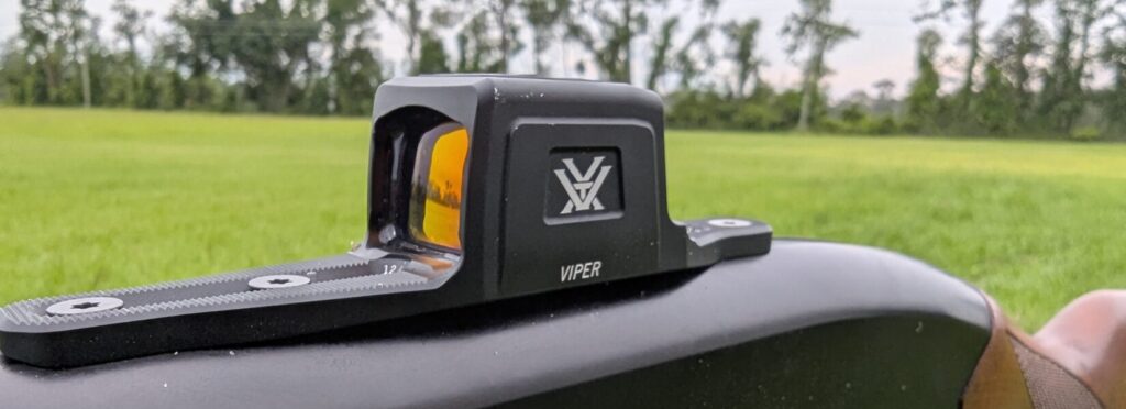 Side view of a Vortex Viper red dot sight mounted on a shotgun.