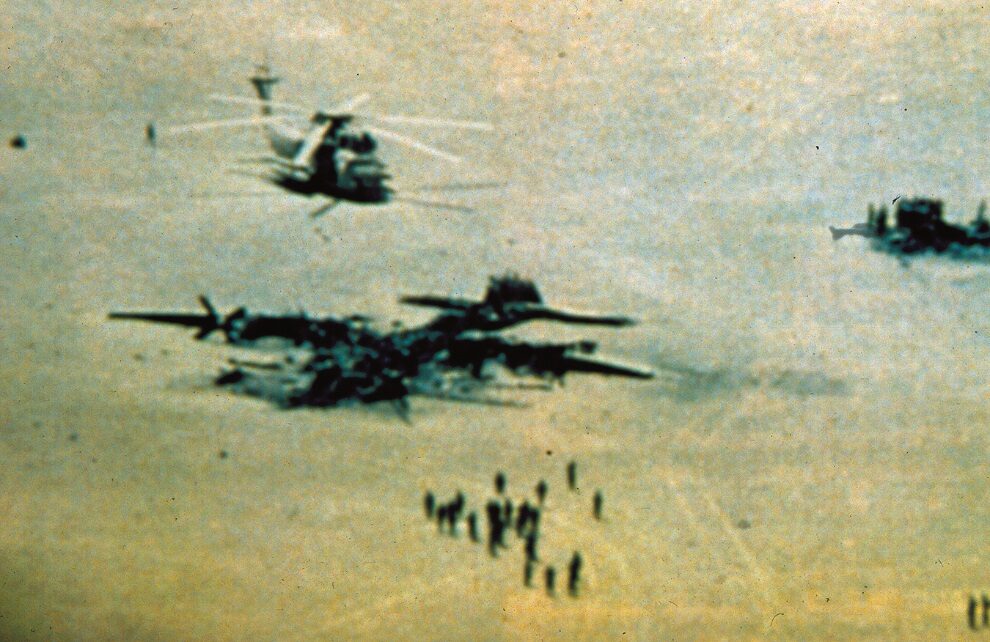 Wreckage at Desert One, Iran (April 1980), where eight Americans died. (Photo courtesy USSOCOM. Public Domain).