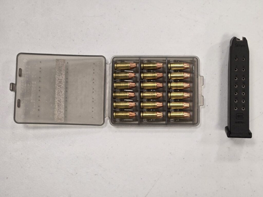 18 rounds of 9mm ammunition along with a single Glock magazine