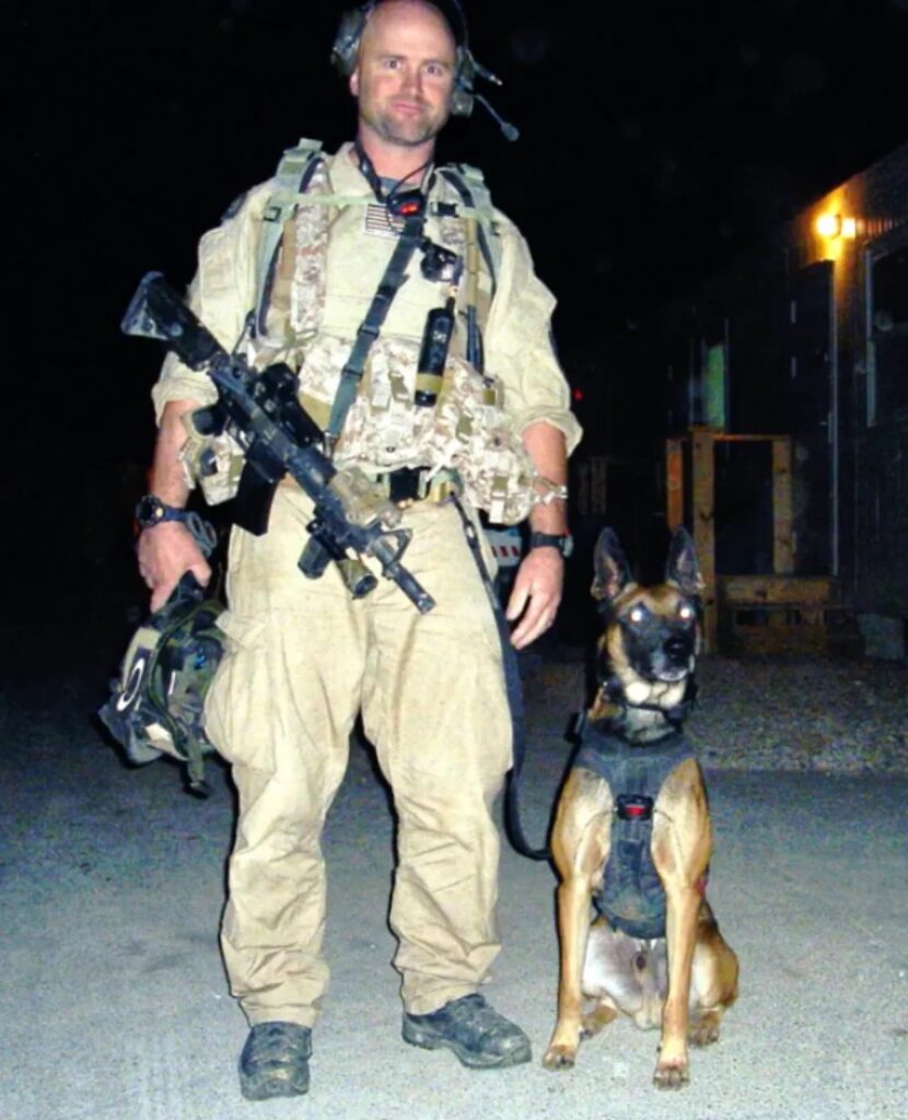 Jimmy Hatch standing next to SOF K9 Spike in Iraq. Spike was the inspiration for Spikes K9 Fund