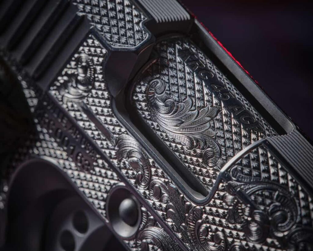 Deep engraving on a 1911 barrel and ejection port area.