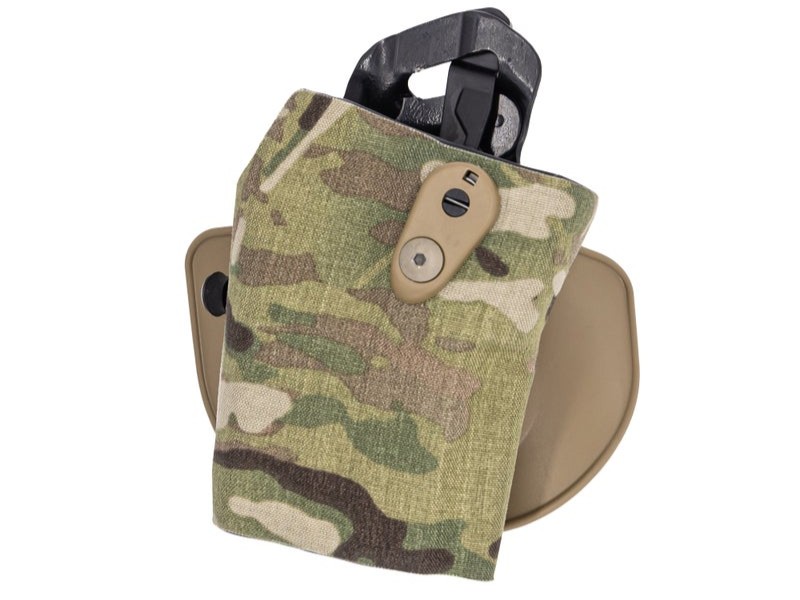 A camouflaged RDSC holster with no gun in it and a white background. Safariland acronyms