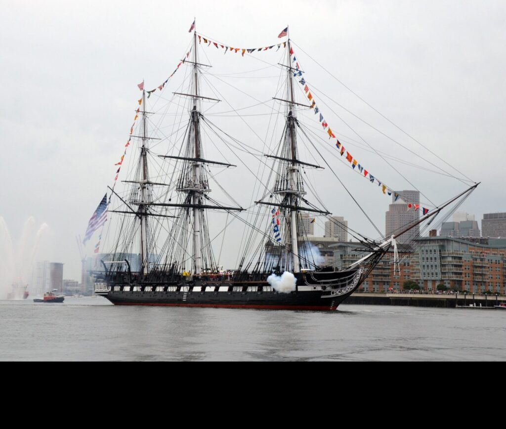 BOSTON (July 4, 2014) USS Constitution fires a 17-gun salute near USS Constitution fires a 17-gun salute near U.S. Coast Guard Base Boston during the ship's Independence Day underway demonstration in Boston Harbor.