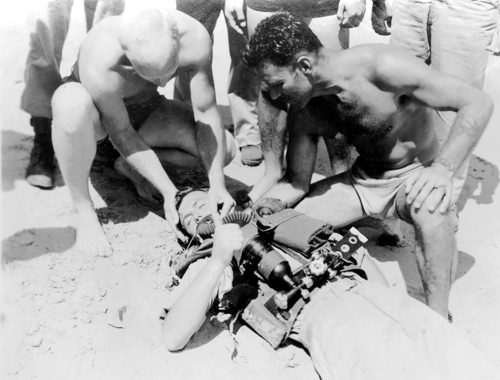 An underwater combat swimmer of the Office of Strategic Services Detachment 404 Maritime Unit experiences hypoxia while using a rebreather in 1944. It was a temporary malfunction. (Photo courtesy CIA. Public Domain)