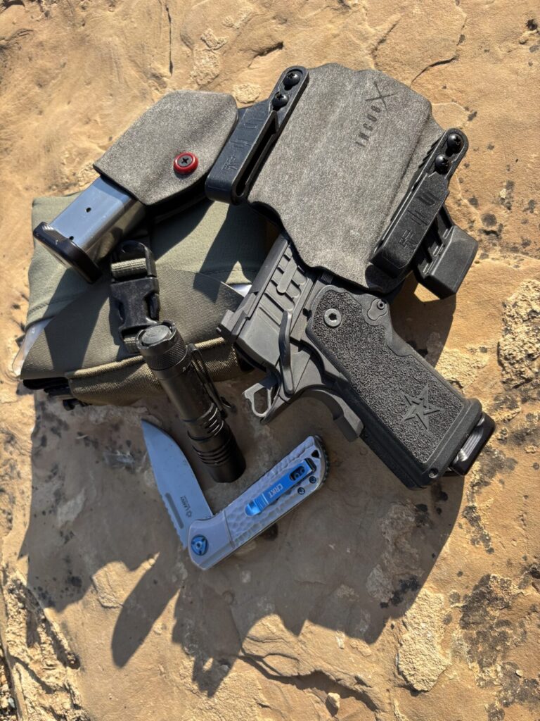 Staccato in Incog X with mag caddy, flashlight, folding knife.