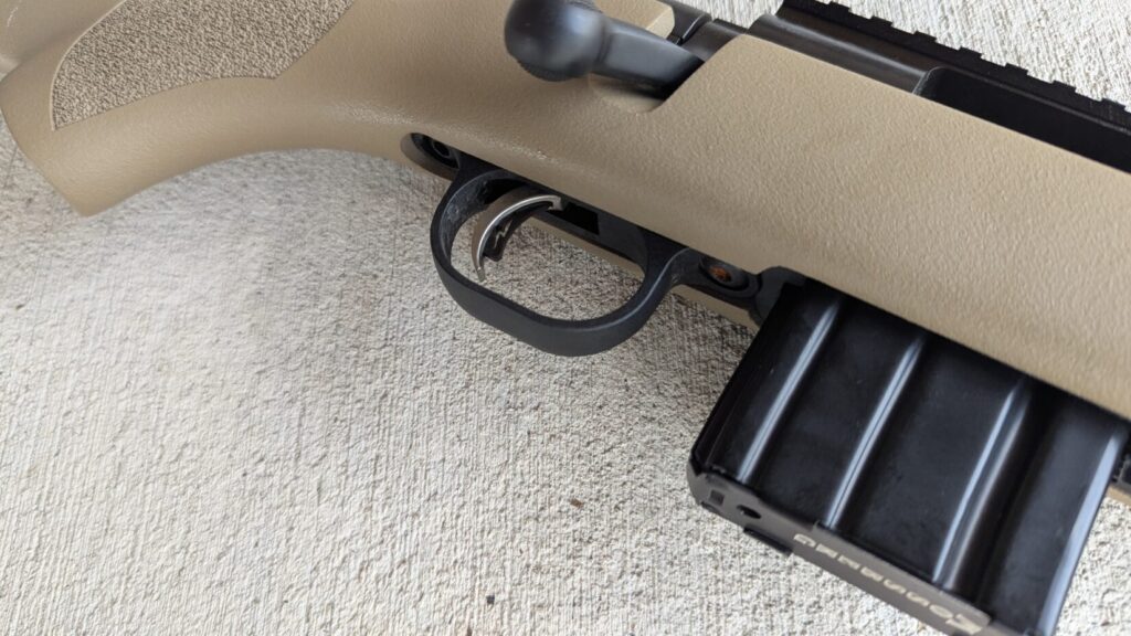 A close-up of the Mossberg MVP Patrol rifle's trigger and magazine.
