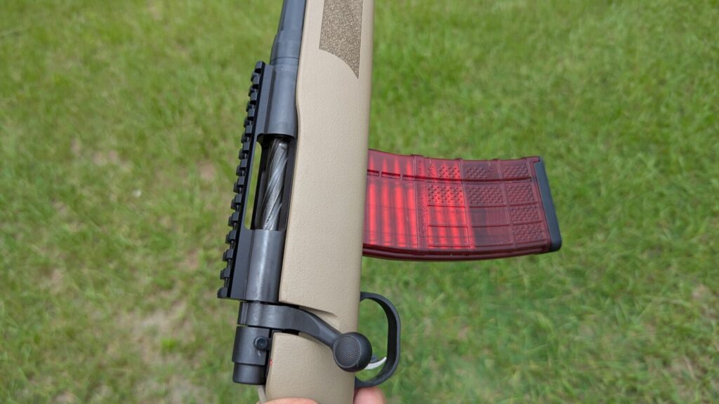 A close-up of the Mossberg MVP Patrol rifle's trigger and magazine.