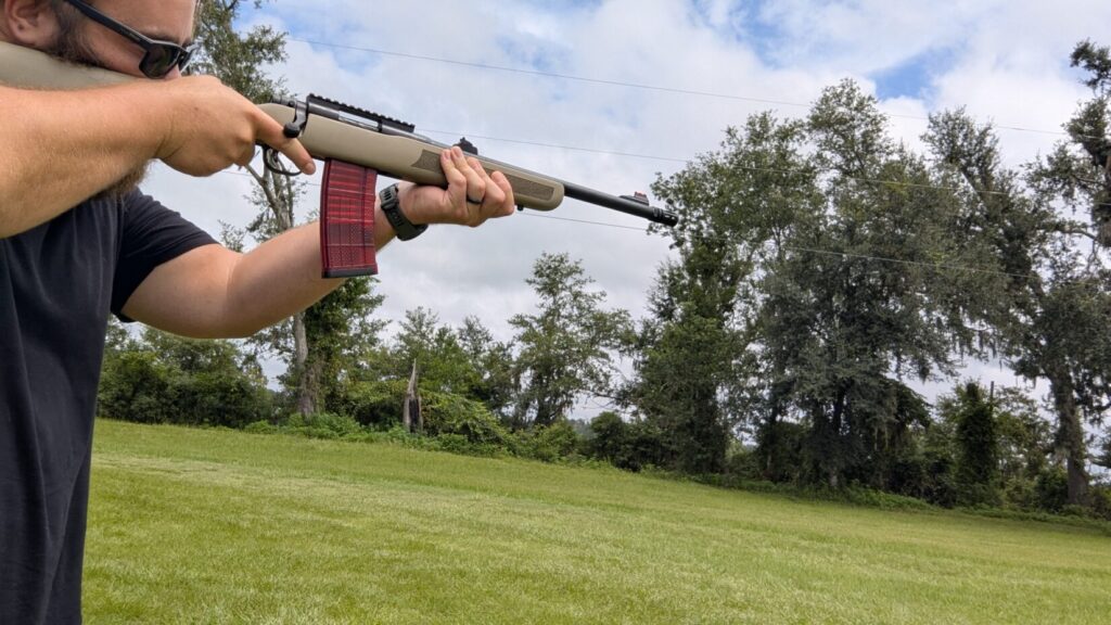 Person aiming a Mossberg MVP Patrol rifle.