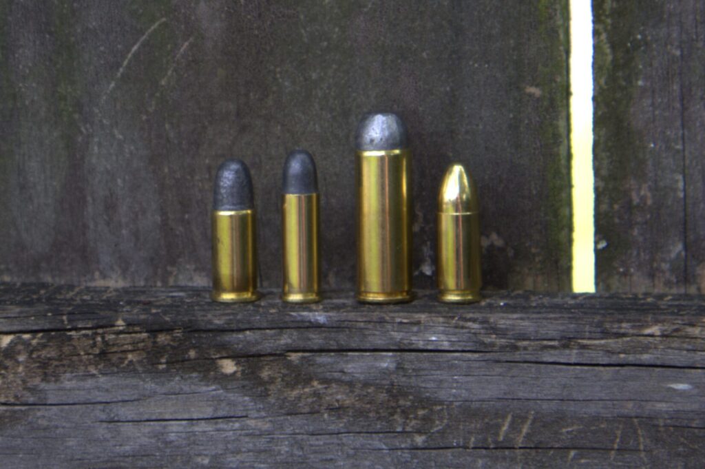 police pistol cartridges from left to right: 38 s&w, 32 s&w long, 45 colt, and 9mm luger
