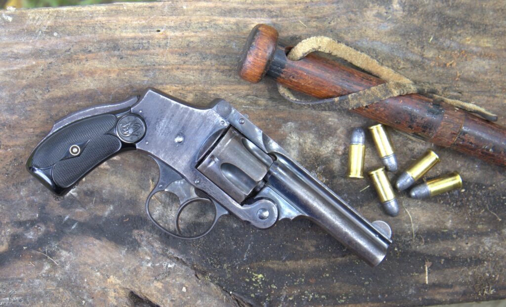 smith and wesson lemon squeezer revolver with nightstick and cartridges