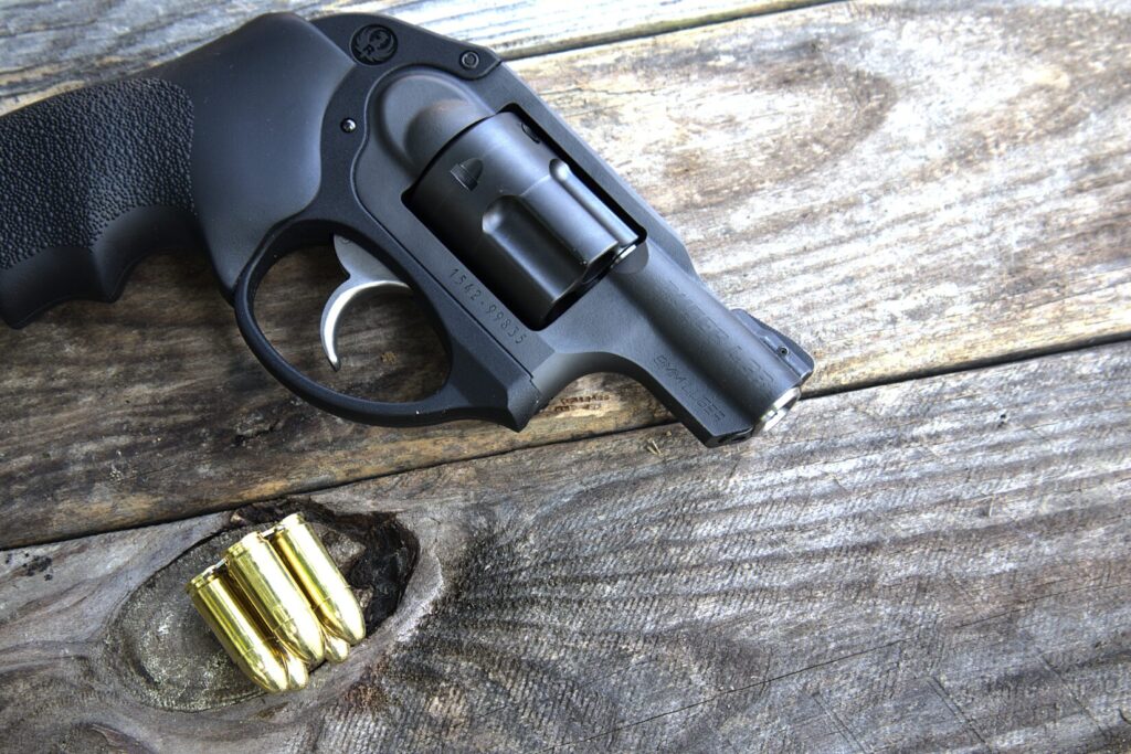 ruger lcr on wooden boards with a loaded moon clip