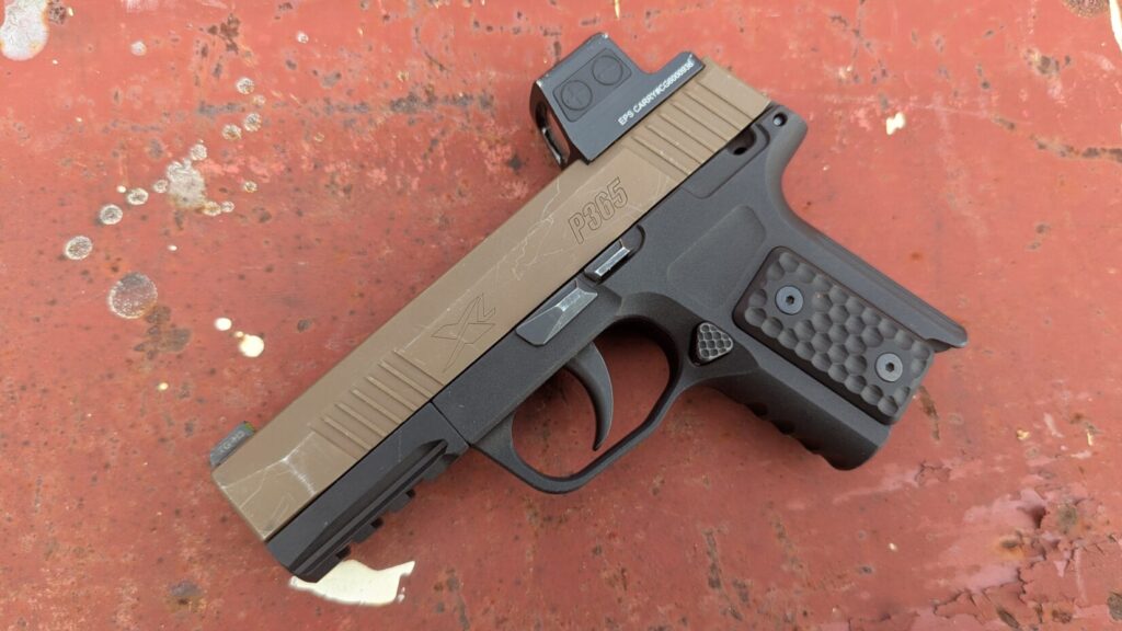 P365 with long size S365 grip module on red surface.