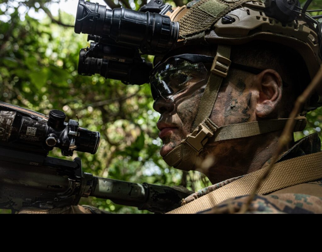 A U.S. Marine with the 31st Marine Expeditionary Unit tests a 3D printed PVS-31 mount in a simulated field scenario at Camp Hansen, Okinawa, Japan. The 31st MEU is the Marine Corps’ only continuously forward-deployed MEU, ready to perform a wide range of military operations as the premier crisis response force in the Indo-Pacific region. (U.S. Marine Corps photo by Lance Cpl. Raul Sotovilla. Public Domain)