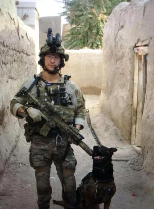 Pictured is SOF K9 handler Aaron Grider with SOF K9 Bohdi during a combat mission in Afghanistan 