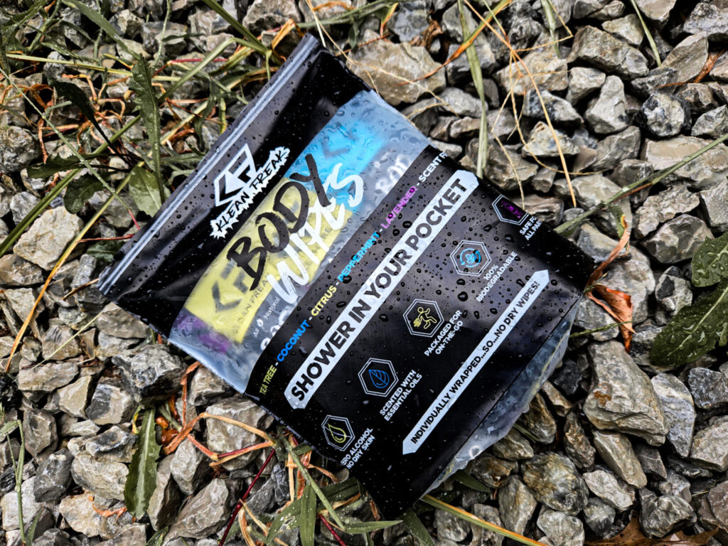 a pack of cleaning wipes on a gravel background