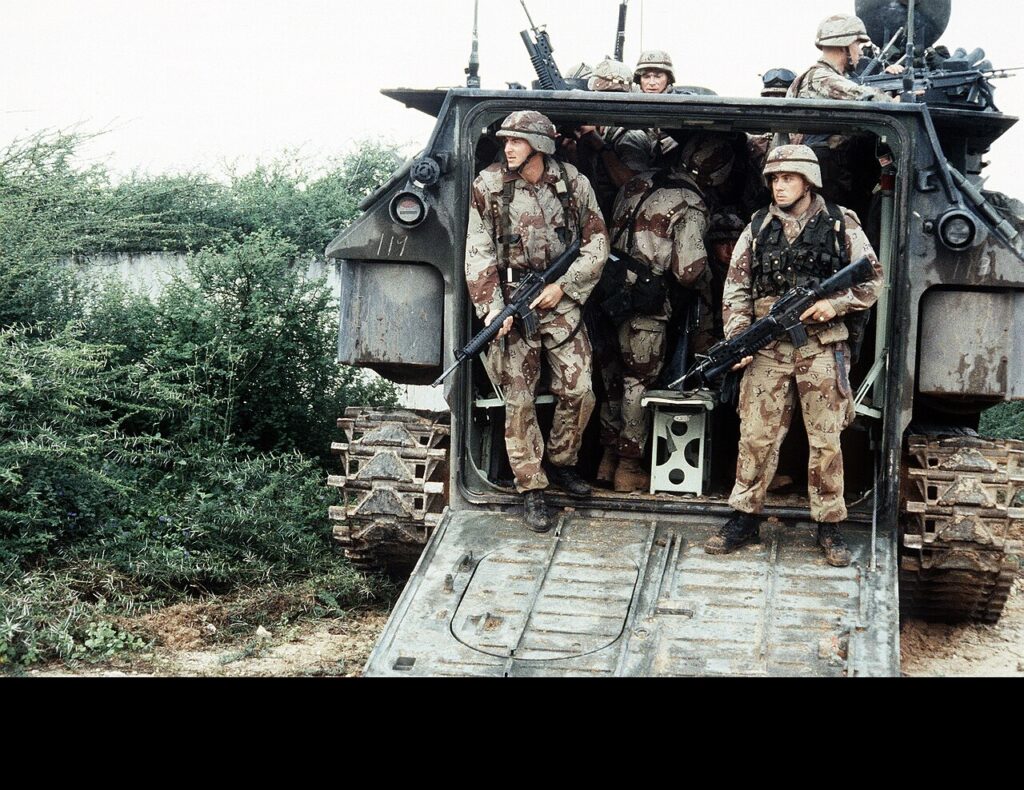 U.S. Marines prepare to exit an AAV-7A1 amphibious assault vehicle during the multinational relief effort Operation Restore Hope. (U.S. Navy photo by PHCM Terry C. Mitchell. Public Domain)