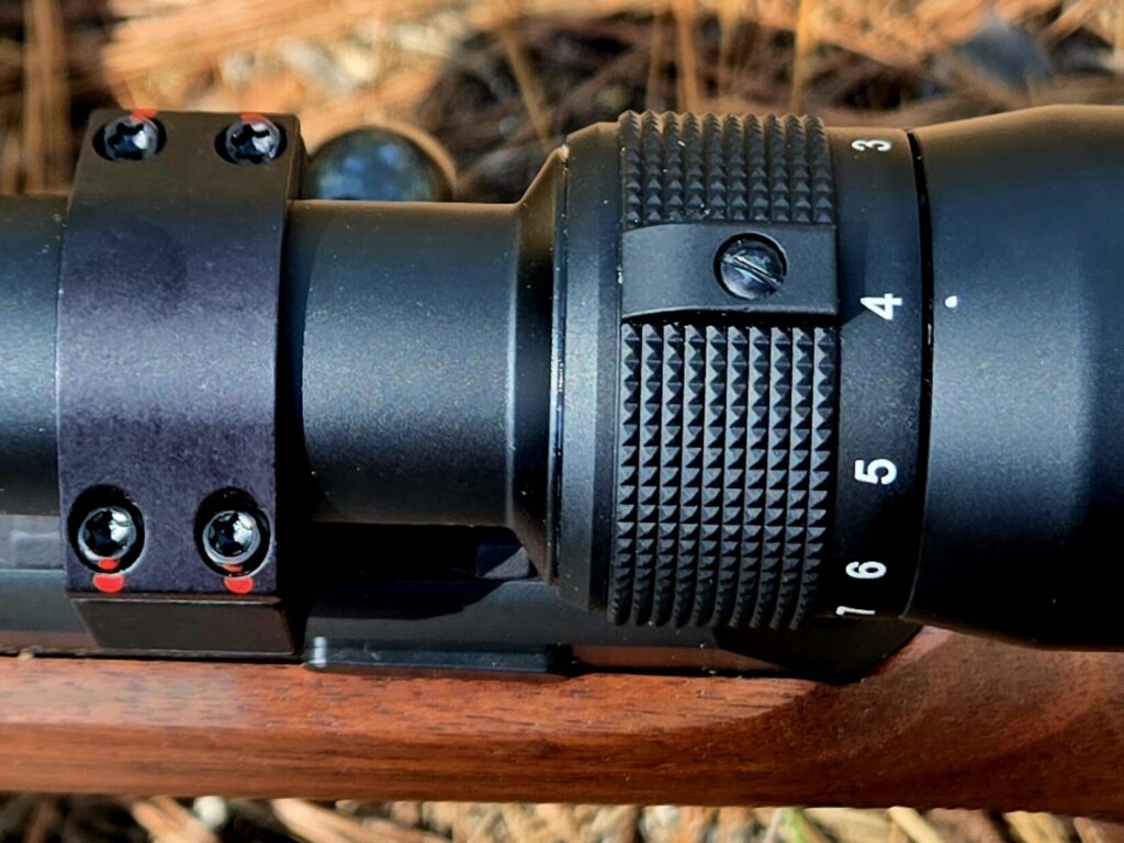 A rifle optic and scope ring as seen from above