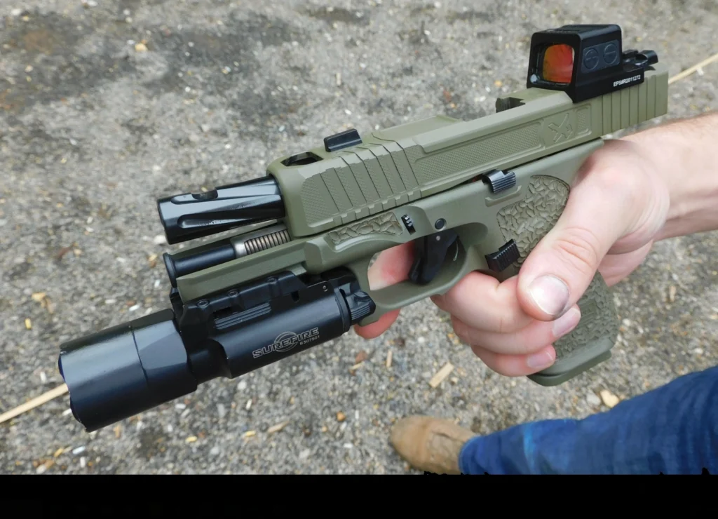 Danger Close Armament Glock 45 tactical pistol with a Holosun red dot and Surefire weapon light