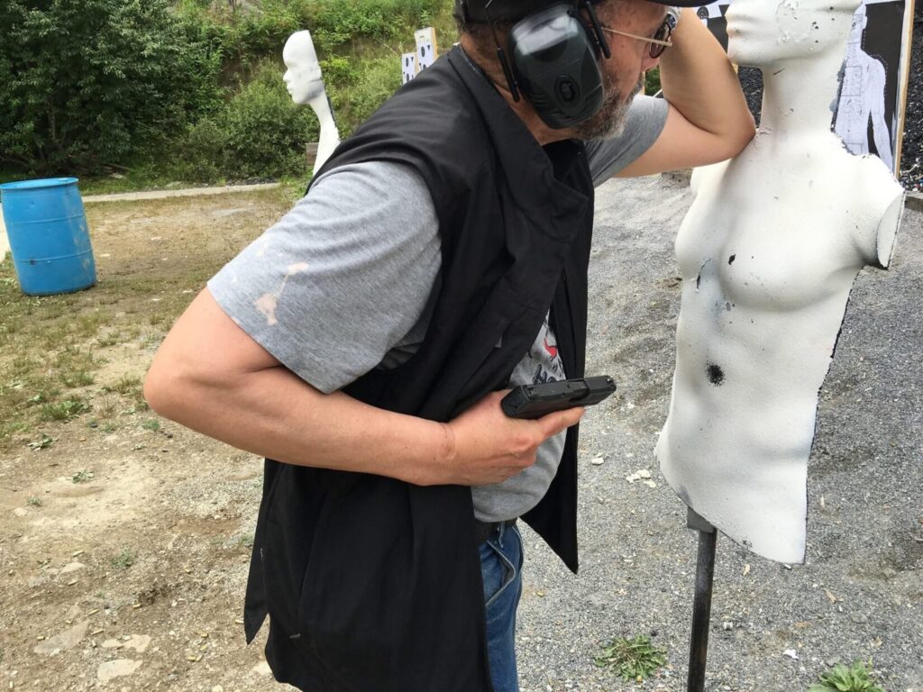 Stretz Tactical student practices shooting from retention.