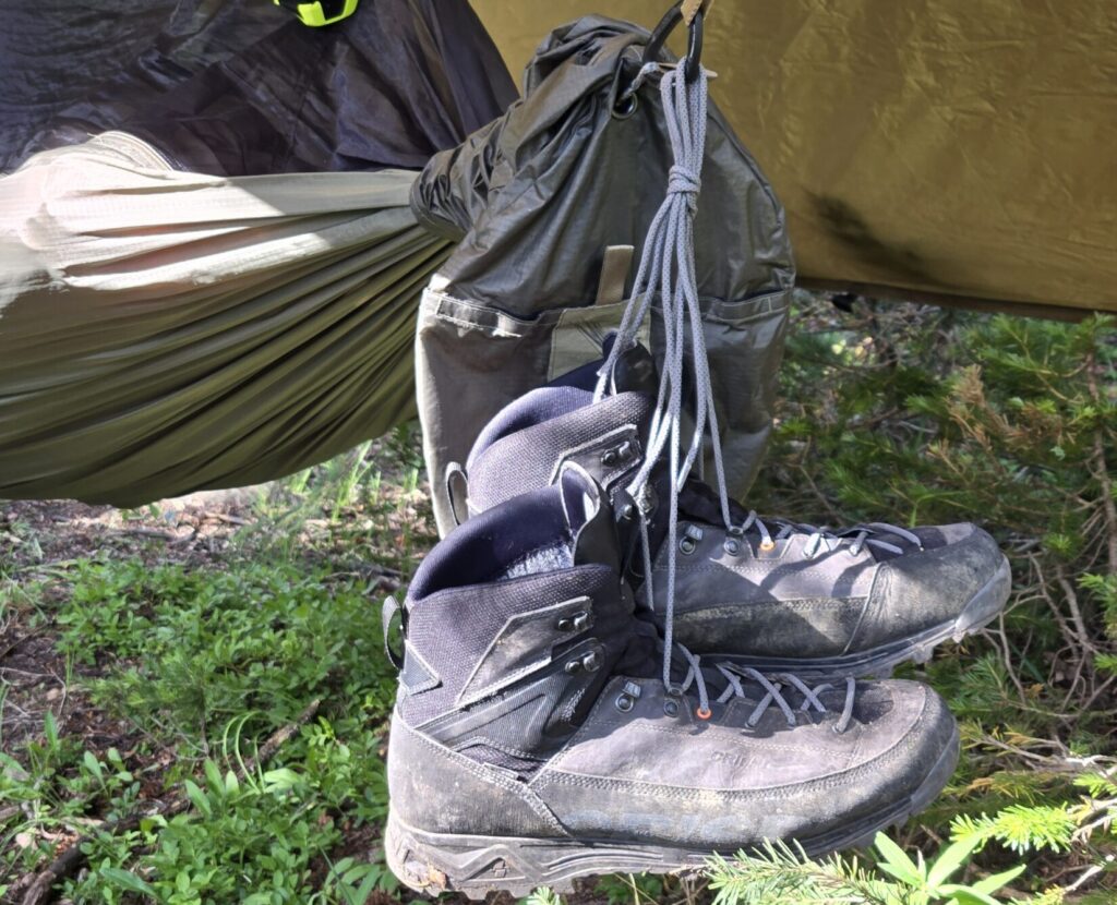 Grey Crispi hunting boots hang from a hammock carabiner