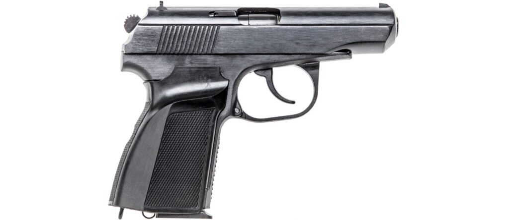 A black Makarov PM pistol is shown against a white background. It's a small, compact handgun with a textured grip