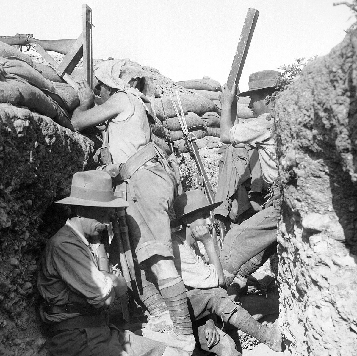 Soldier aiming a periscope rifle in WW1 trench