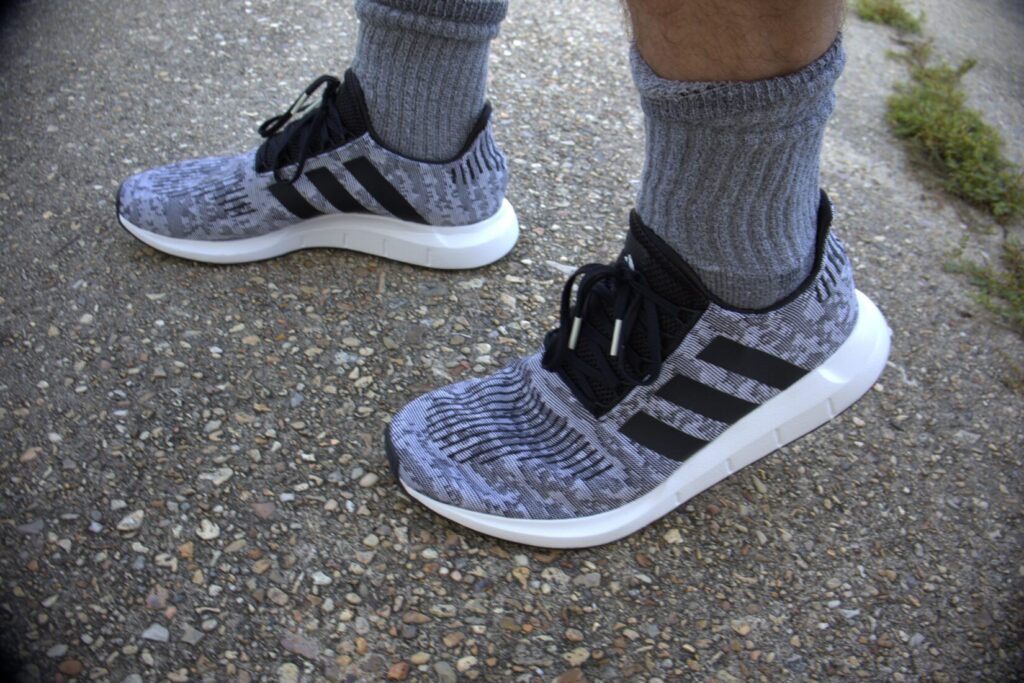 running shoes on the sidewalk