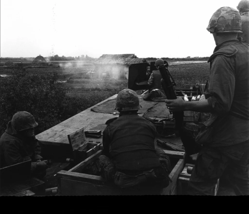 Photo of US Navy SEALS on a river gunboat in Vietnam
